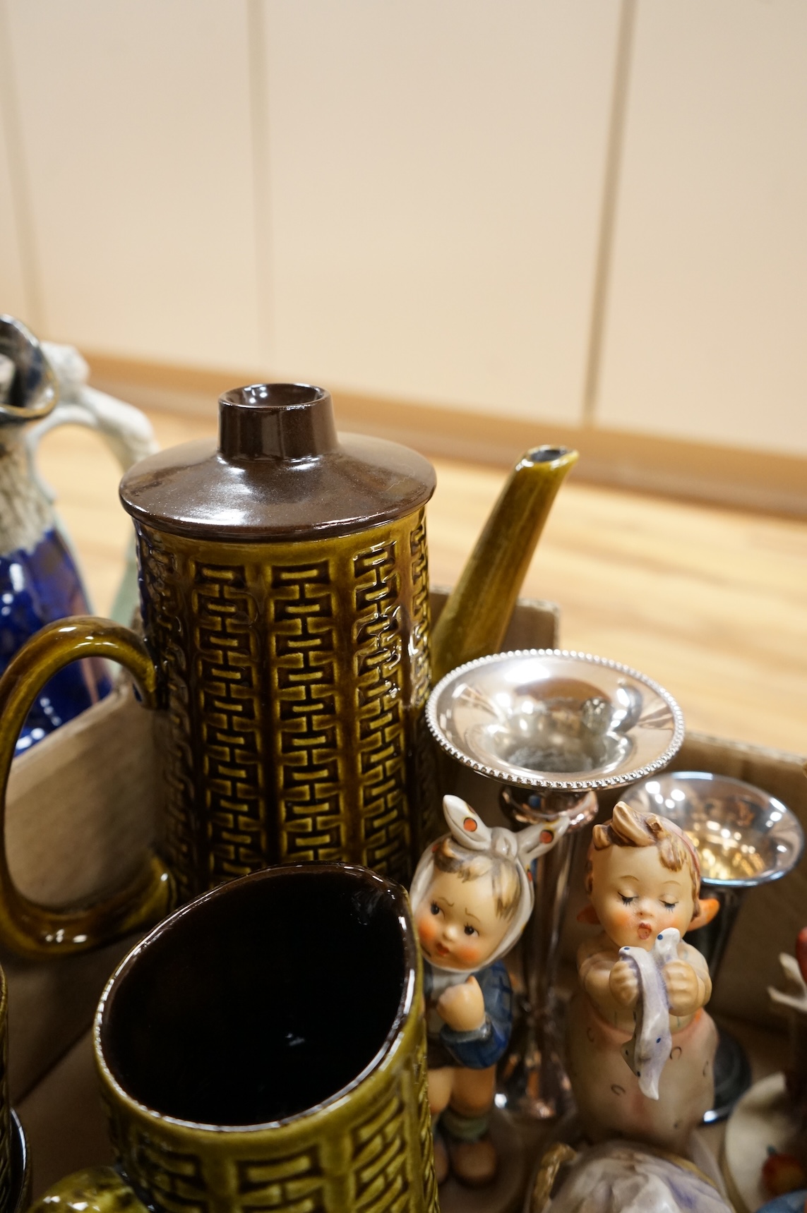 A collection of ceramics to include Doulton Toby jugs, Goebel figurines and Adderley part tea set
